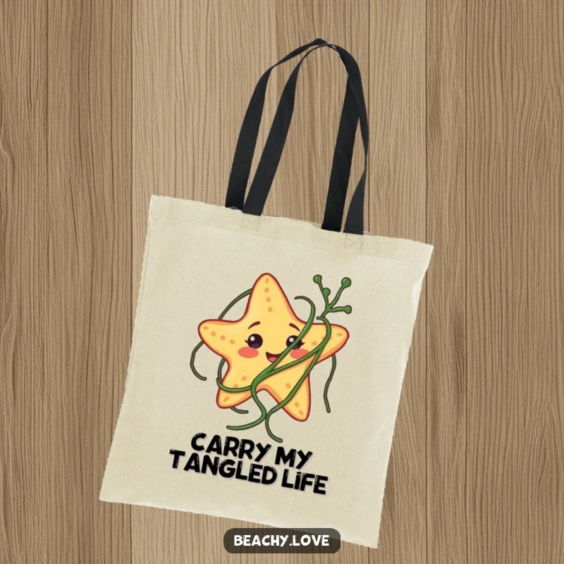 Funny tote bag with a smiling starfish endearingly tangled in a strand of seaweed, ideal for beach trips.